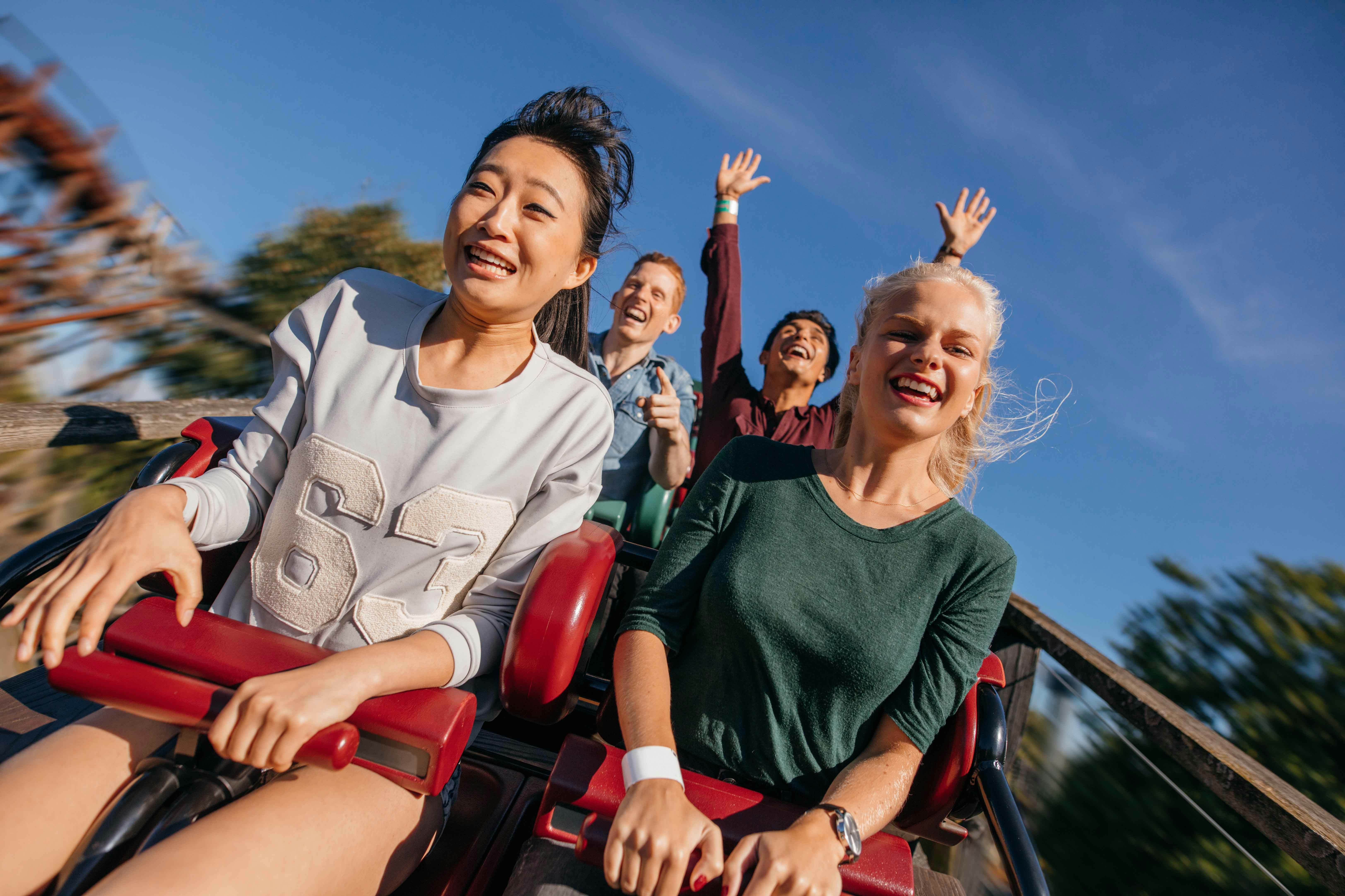 Roller coaster at Belantis Leipzig theme park, Germany, with riders enjoying the thrill.