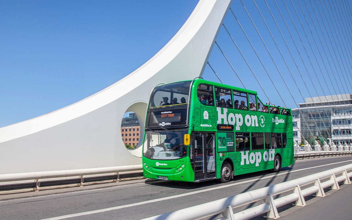Dublin hop-on hop-off bus crossing Samuel Beckett Bridge.