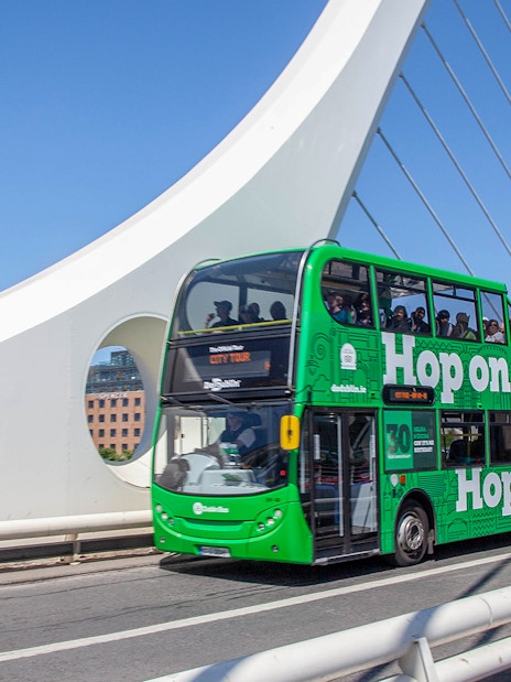 Dublin hop-on hop-off bus crossing Samuel Beckett Bridge.