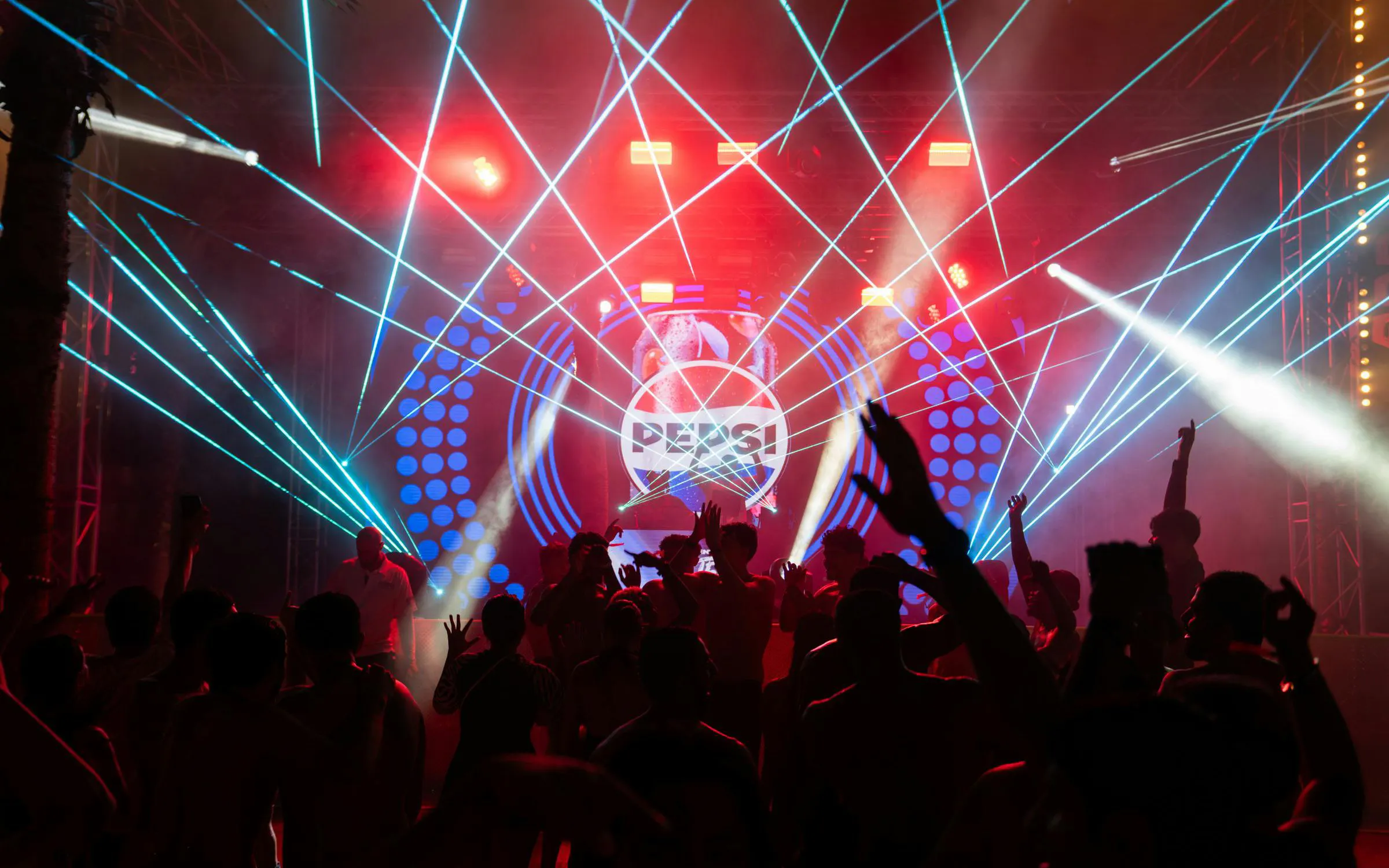 Crowd enjoying laser lights at Aquaventure After Dark party.