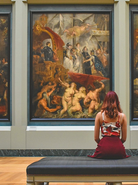 Guest viewing paintings inside Kunsthistorisches Museum Vienna.