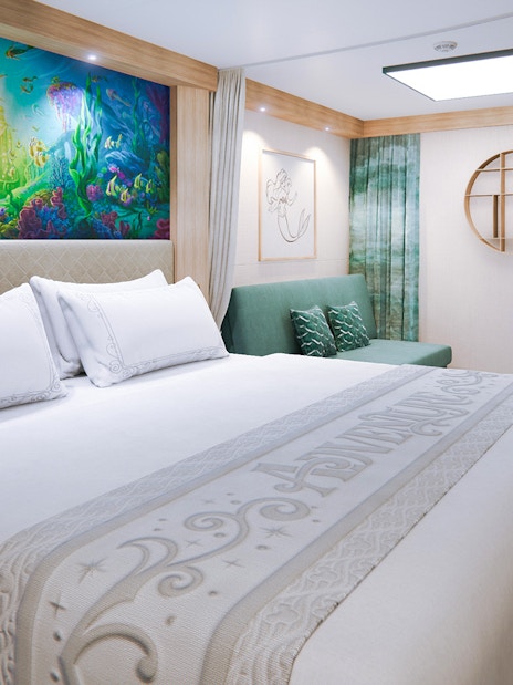 Deluxe Inside Stateroom with ocean-themed decor on Disney Adventure Cruise.