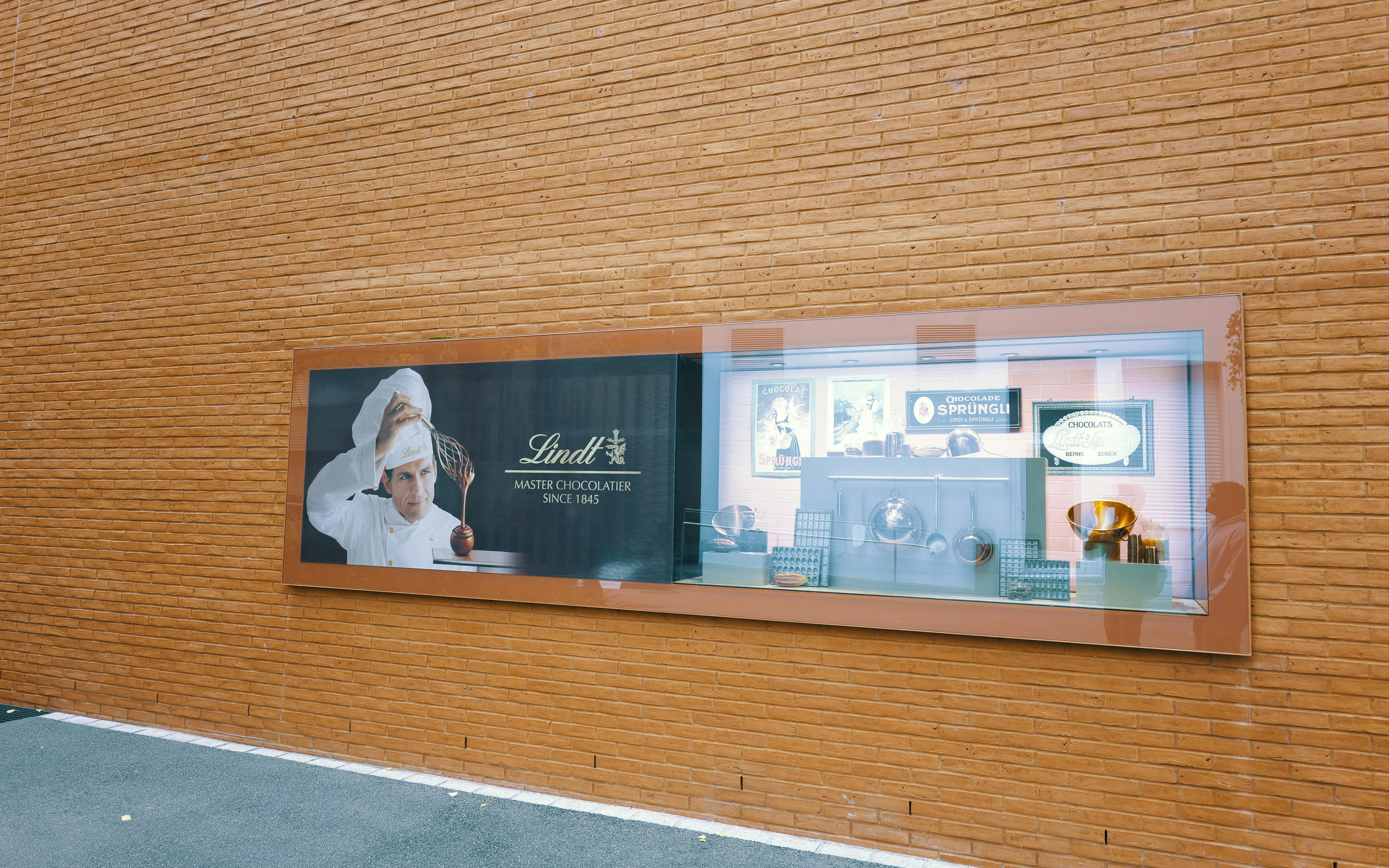 Lindt Chocolate Museum display with chocolatier and vintage chocolate-making tools.