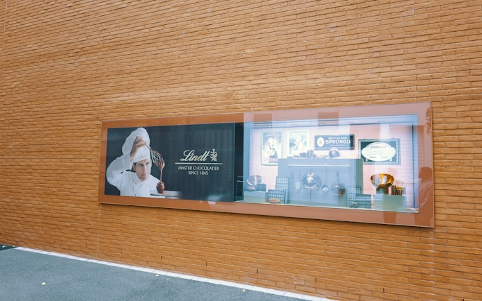 Lindt Chocolate Museum display with chocolatier and vintage chocolate-making tools.
