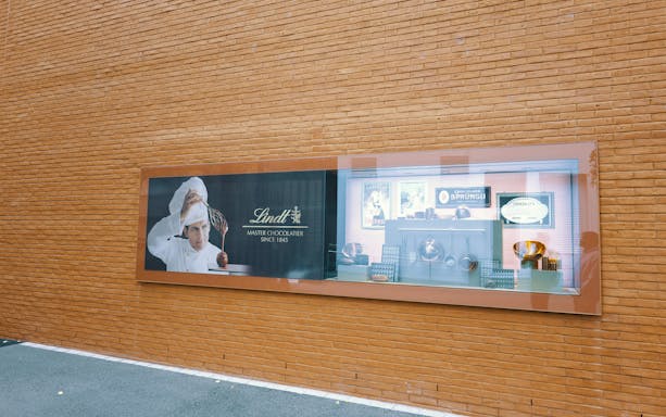 Lindt Chocolate Museum display with chocolatier and vintage chocolate-making tools.