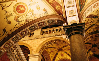Ornate ceiling and column inside the Hungarian State Opera House, Budapest.