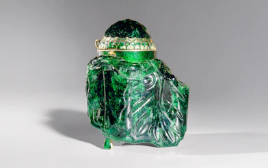 Emerald vessel with intricate carvings at Imperial Treasury Vienna.