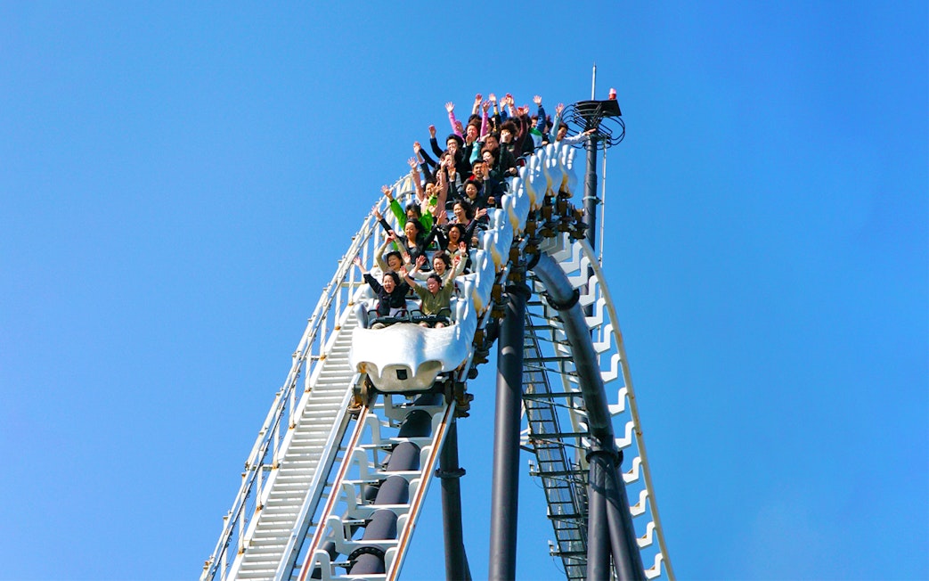 Visitors riding a rollercoaster at Fuji-Q Highland, Japan.