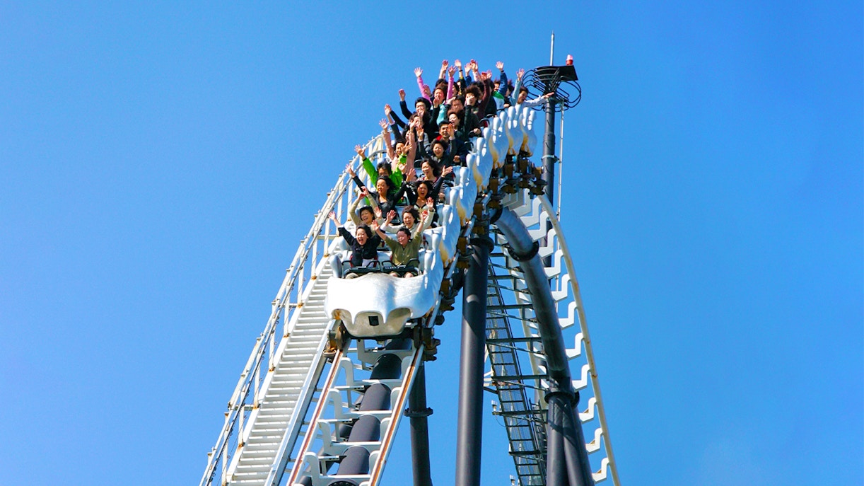Visitors riding a rollercoaster at Fuji-Q Highland, Japan.
