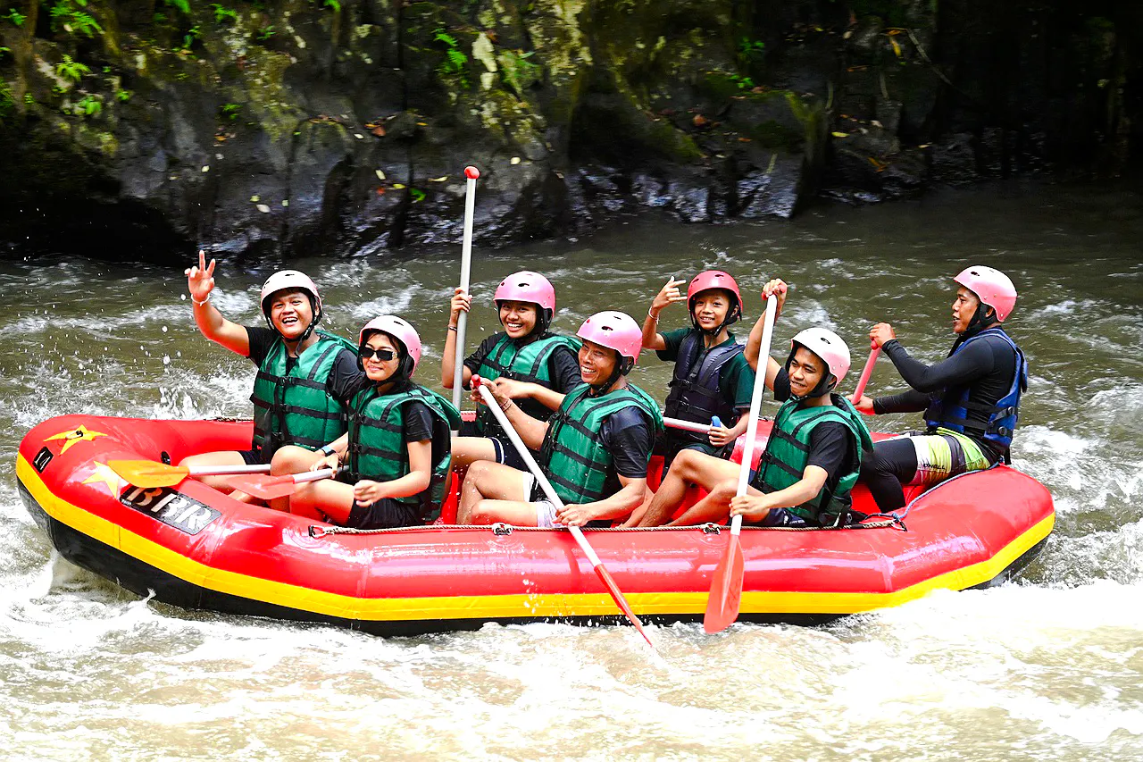 Group rafting on Ayung River, Bali, with guides and paddles, part of 11 km tour with buffet lunch.