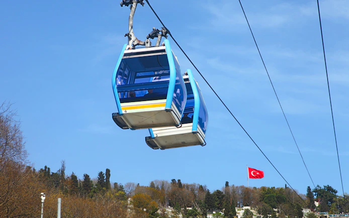 Cable car ascending Pierre Loti hill, Istanbul, with Turkish flag in view.