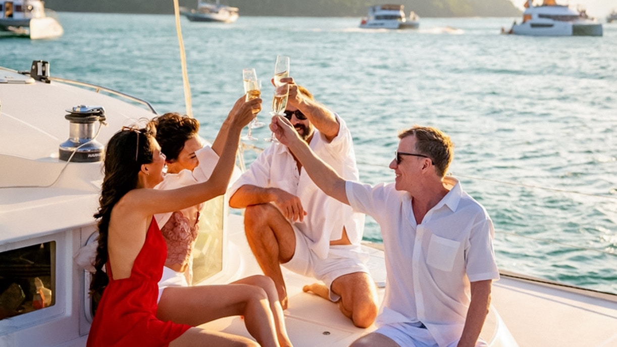 Guests toasting with drinks on a boat tour to Blue Caves.