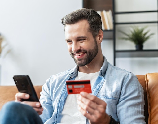 Tourist using a smartphone for online booking of Paris Eiffel Tower tickets.