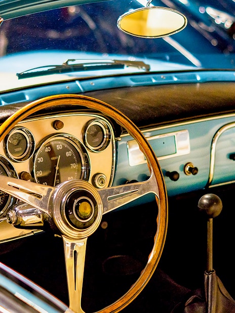Classic car dashboard and steering wheel at Malta Classic Car Collection Museum.