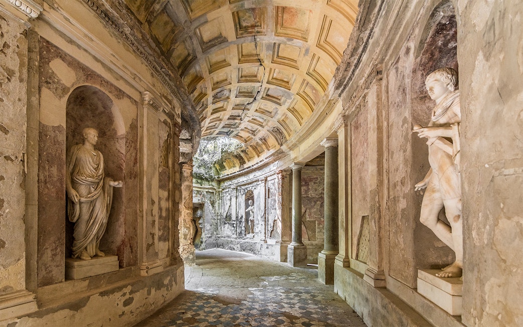 Statues and arched ceiling in the Cryptoporticus, English Garden, Caserta Royal Palace.