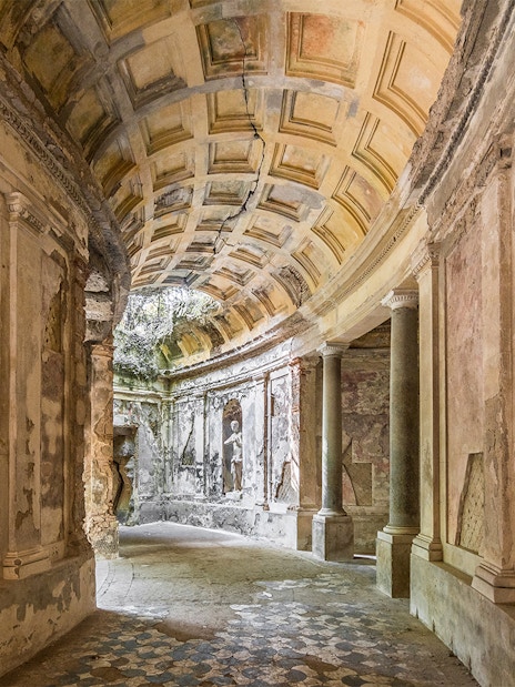 Statues and arched ceiling in the Cryptoporticus, English Garden, Caserta Royal Palace.