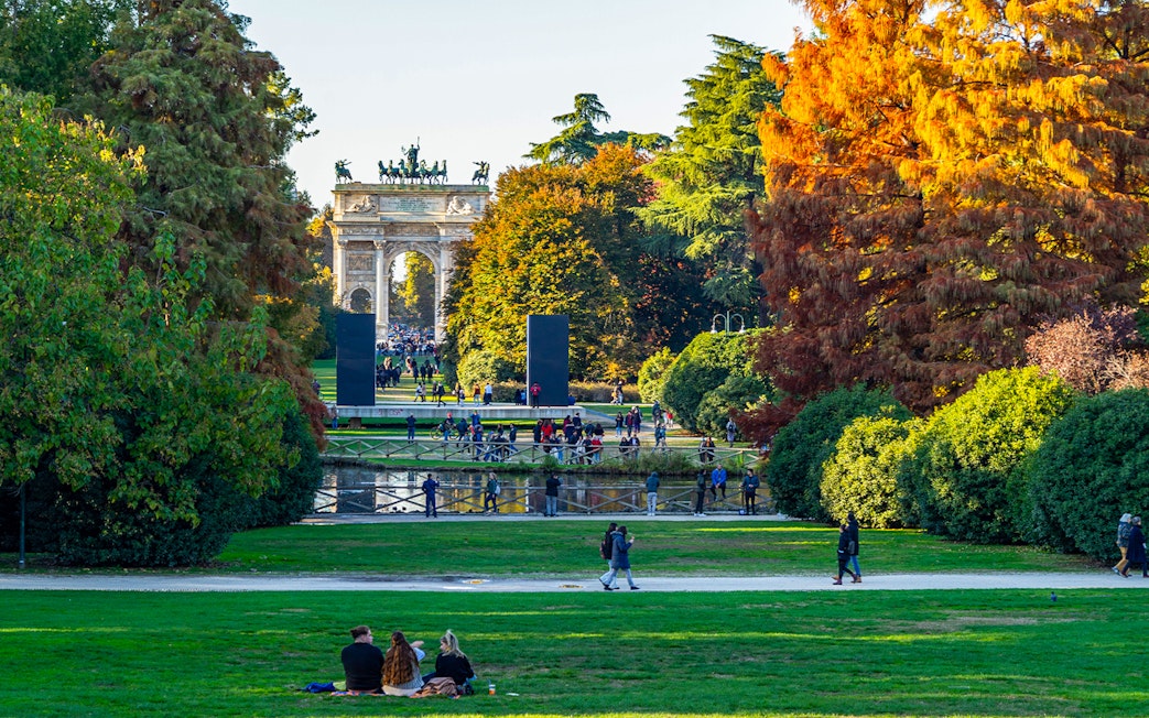 Parco Sempione in Milan during autumn with Arco della Pace in the background, Italy.