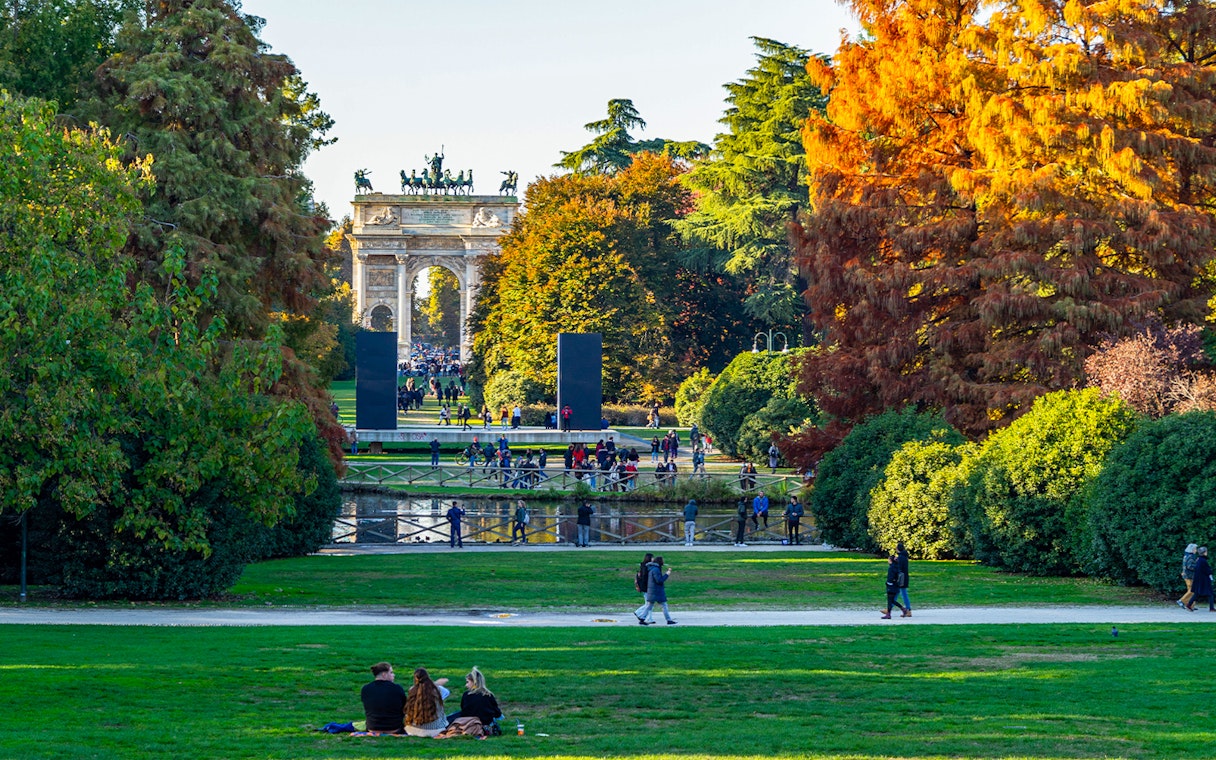 Parco Sempione in Milan during autumn with Arco della Pace in the background, Italy.