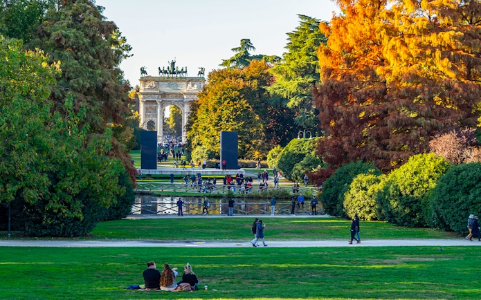 Parco Sempione in Milan during autumn with Arco della Pace in the background, Italy.