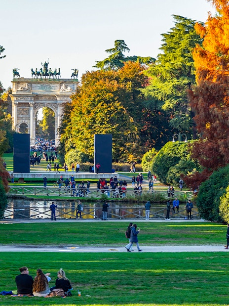 Parco Sempione in Milan during autumn with Arco della Pace in the background, Italy.