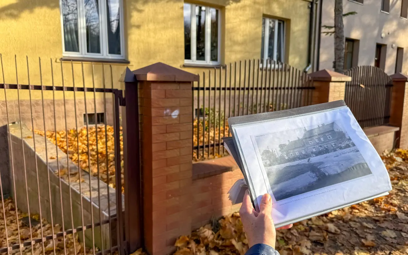 Historical photo comparison at Plaszow Concentration Camp site in Krakow during guided tour.