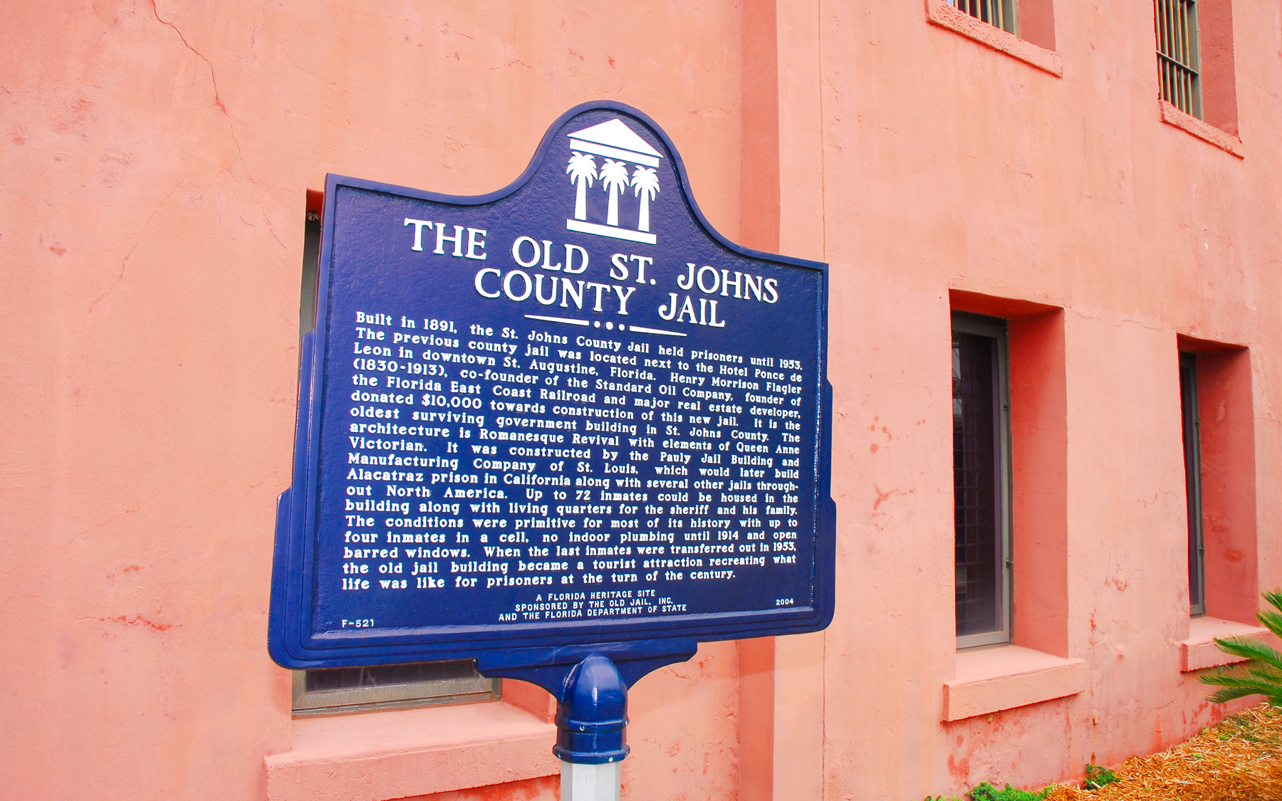 Old St. Johns County Jail sign in St. Augustine, highlighting historical significance.