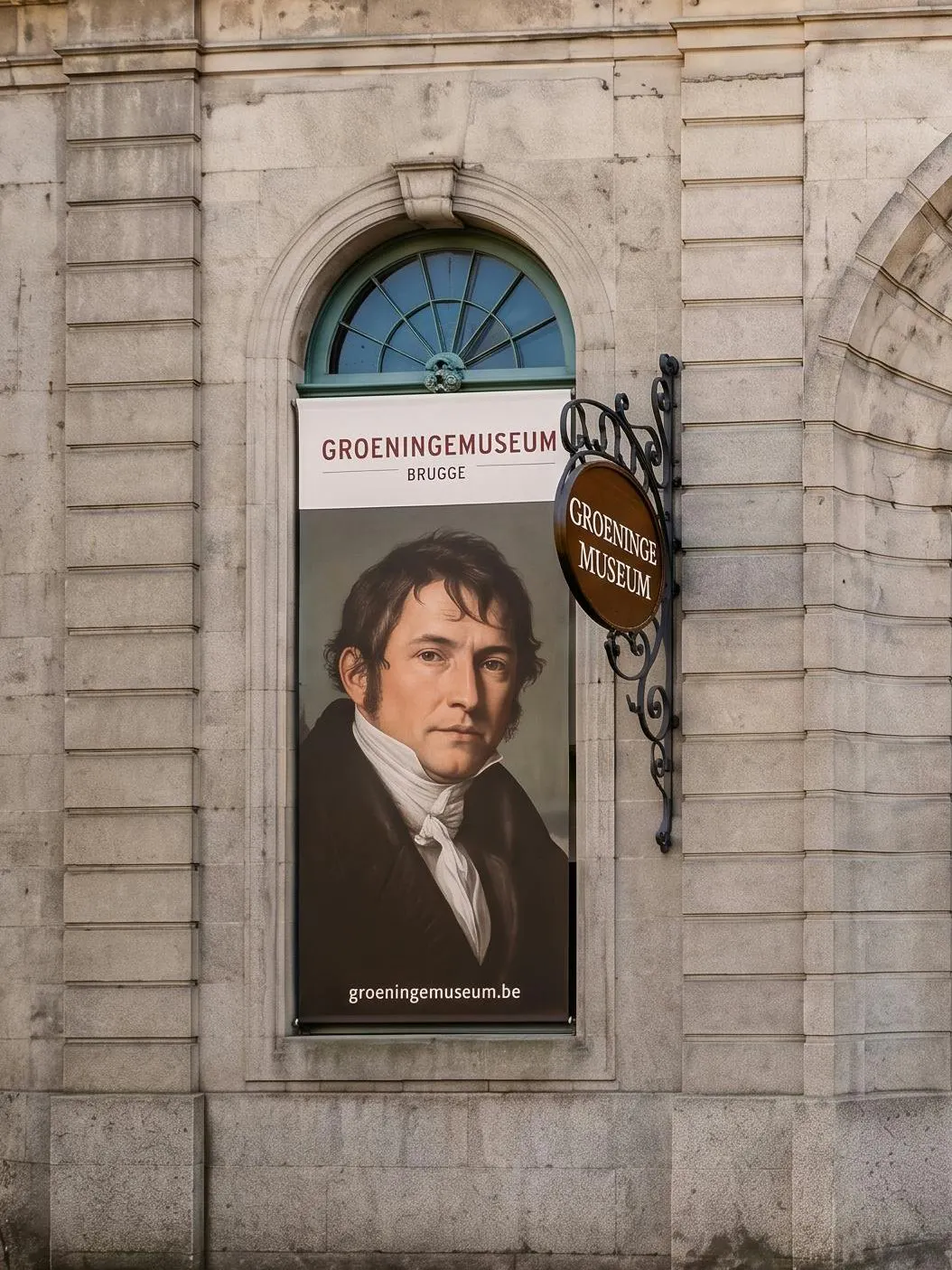 Banner of Groeninge Museum in Brugge with a portrait displayed on a stone building wall.