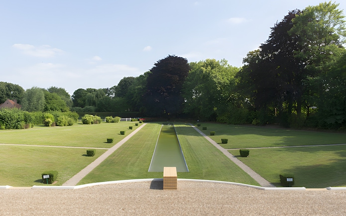 Villa Cavrois garden with central reflecting pool and manicured lawns in Croix, France.