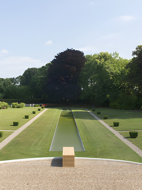 Villa Cavrois garden with central reflecting pool and manicured lawns in Croix, France.