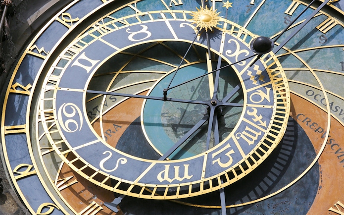 Prague Astronomical Clock close-up with zodiac signs and intricate details.