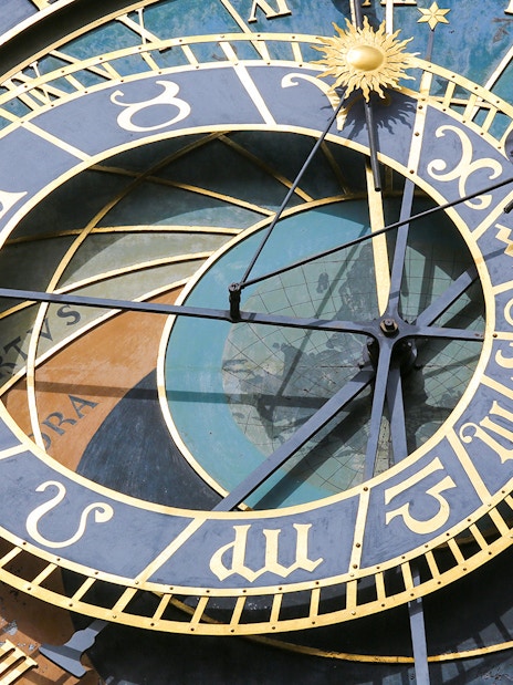 Prague Astronomical Clock close-up with zodiac signs and intricate details.