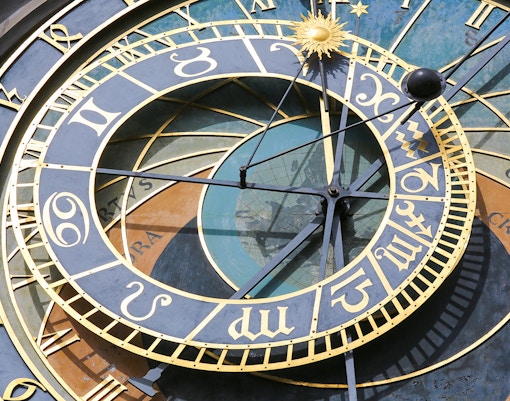 Prague Astronomical Clock close-up showing intricate details and zodiac signs.