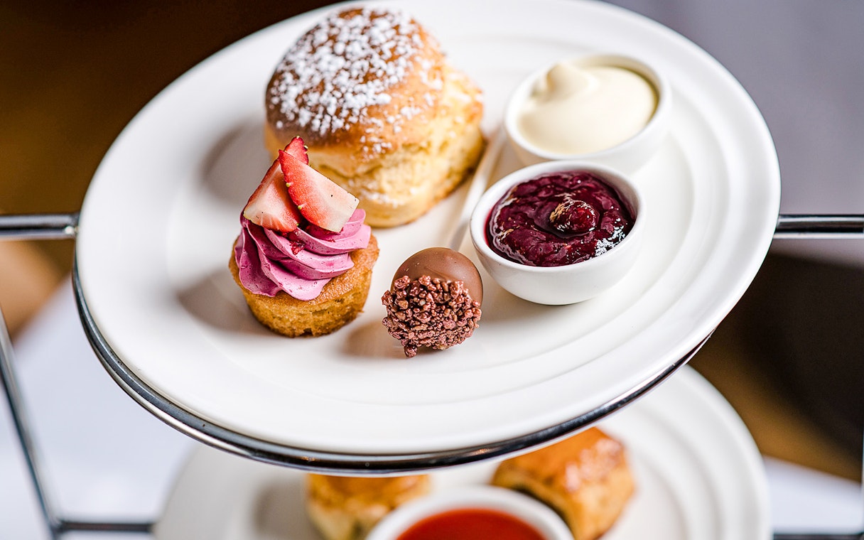High tea desserts at National Gallery of Victoria with scone, cupcake, and jam.