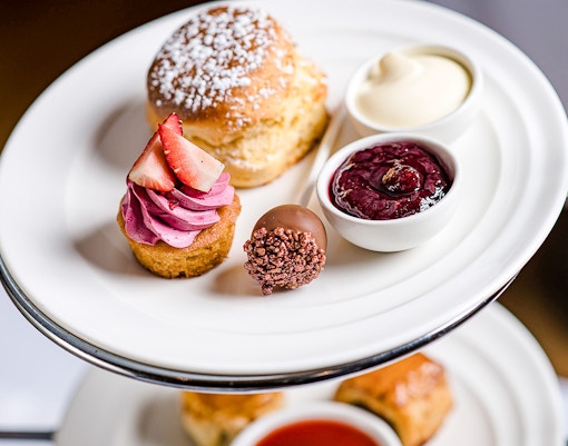 High tea desserts at National Gallery of Victoria with scone, cupcake, and jam.