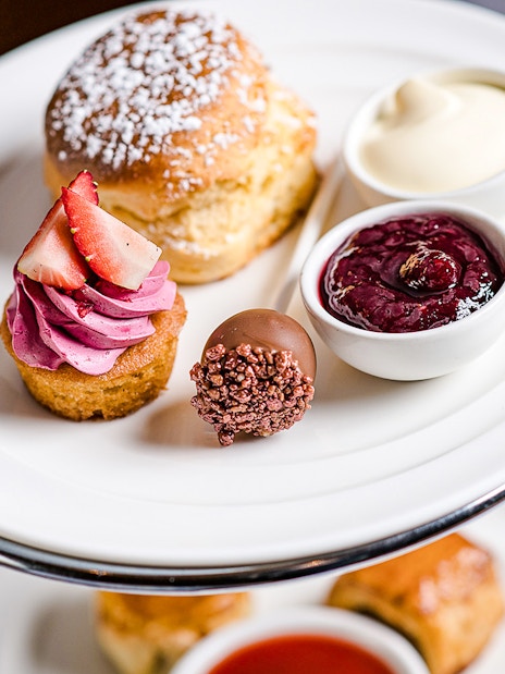 High tea desserts at National Gallery of Victoria with scone, cupcake, and jam.