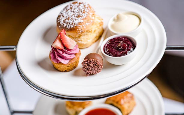 High tea desserts at National Gallery of Victoria with scone, cupcake, and jam.