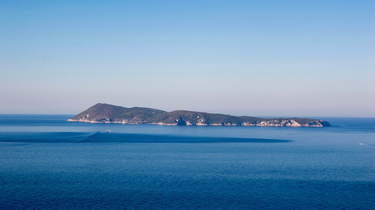 Bisevo Island surrounded by the Adriatic Sea, viewed from a distance.