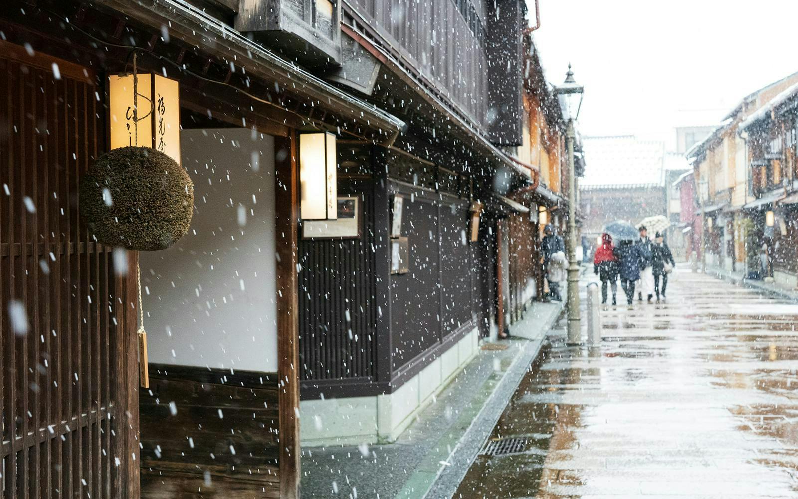 Snowfall on traditional street in Shirakawa-go during day tour from Kanazawa.