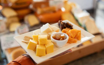 Cheese platter with assorted cheeses and chutney on Jordaan Food Tour.