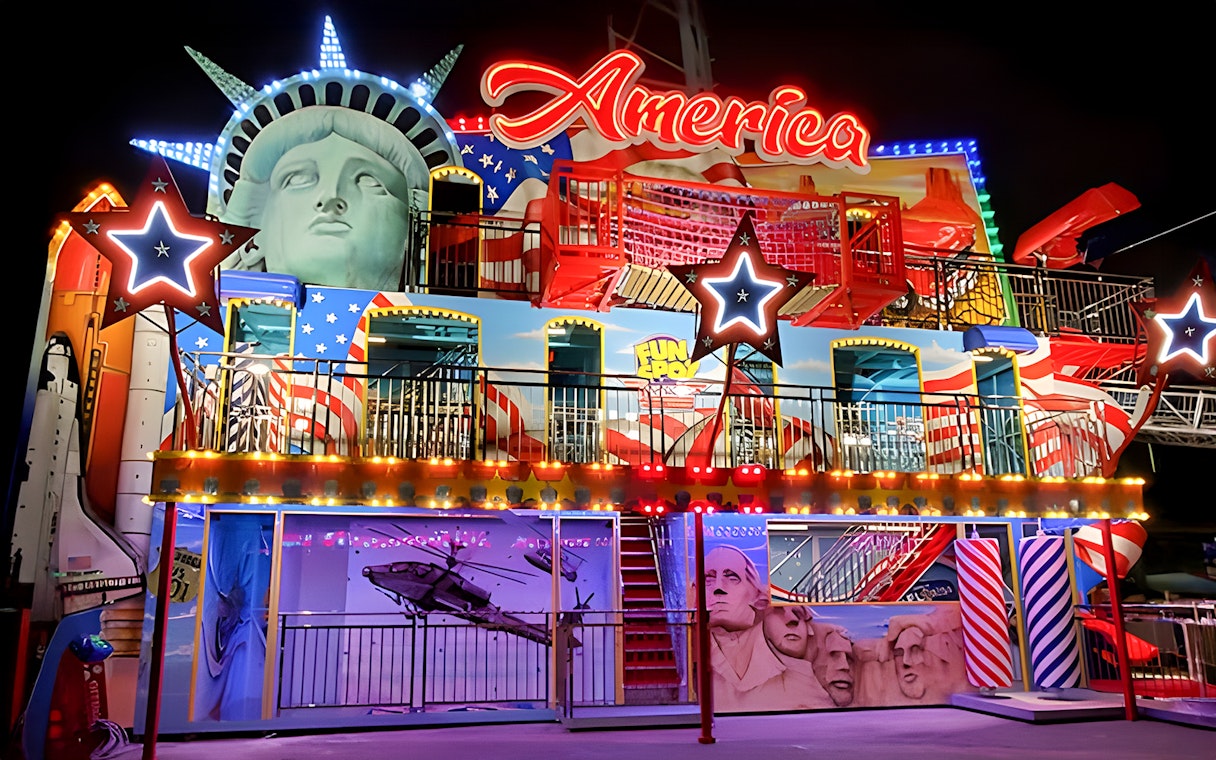 Fun Spot America Theme Park facade with Statue of Liberty and Mount Rushmore elements.