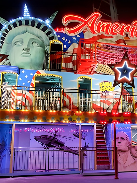 Fun Spot America Theme Park facade with Statue of Liberty and Mount Rushmore elements.