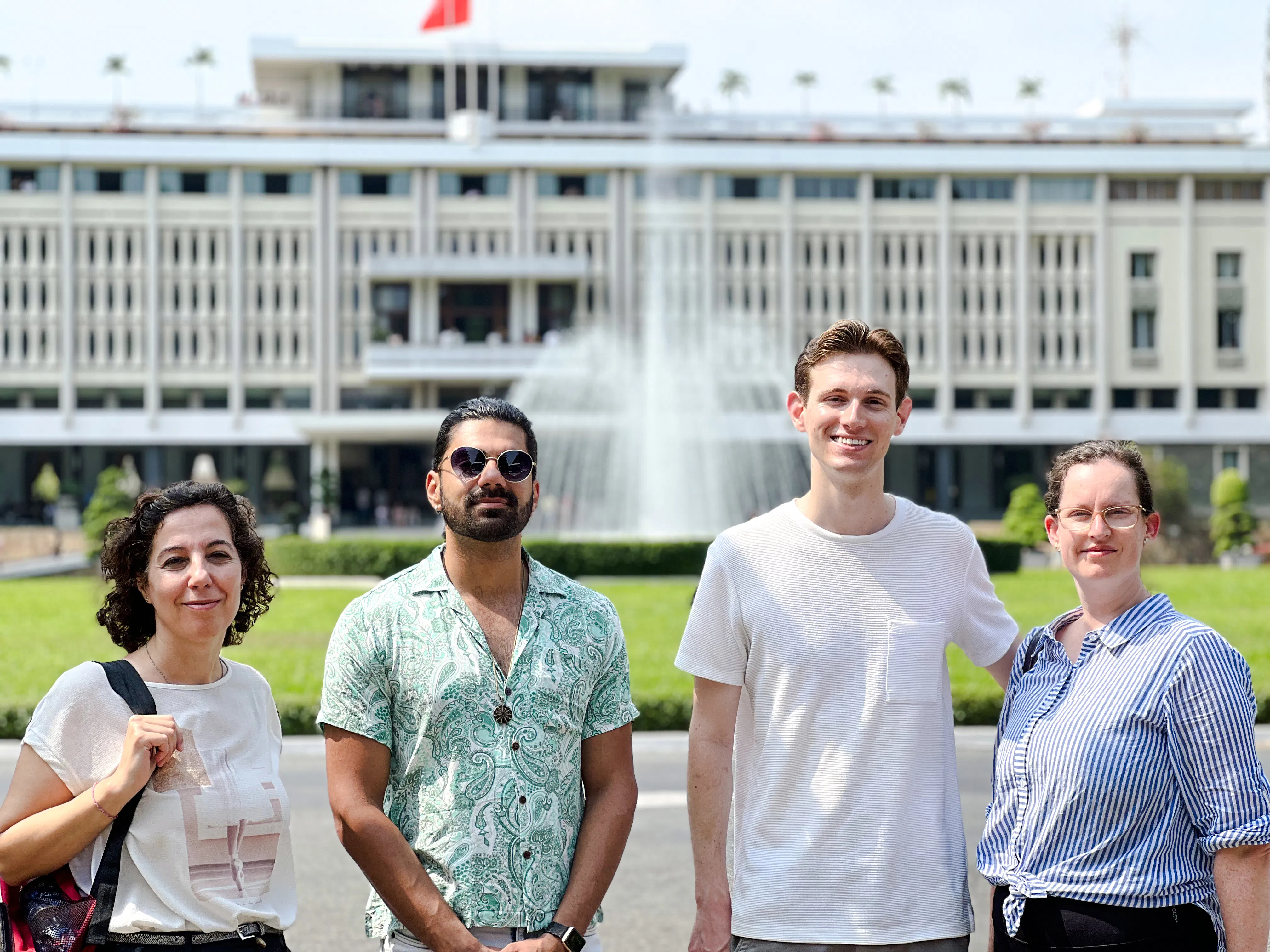 Group of tourists in front of Independence Palace fountain, Saigon, Ho Chi Minh City.