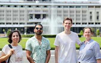Group of tourists in front of Independence Palace fountain, Saigon, Ho Chi Minh City.