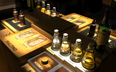 Jameson Whiskey Distillery display with malting grains and aging samples.
