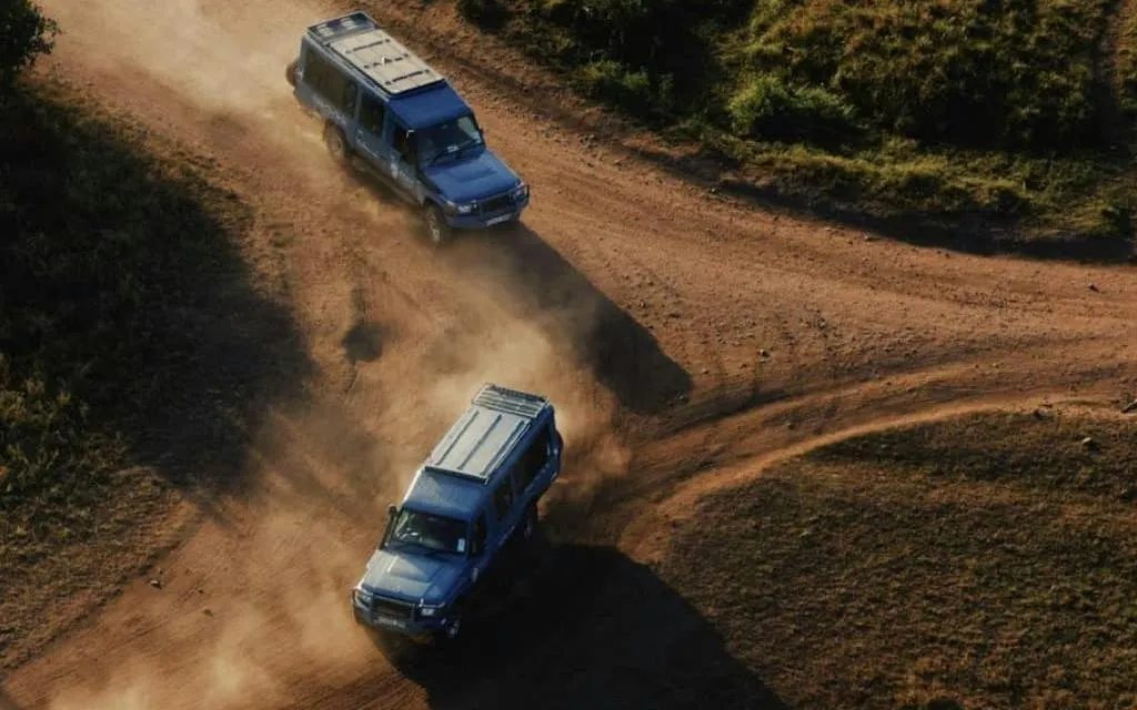 Off-road vehicles on a dirt path near Mererani Tanzanite Mine, Tanzania.