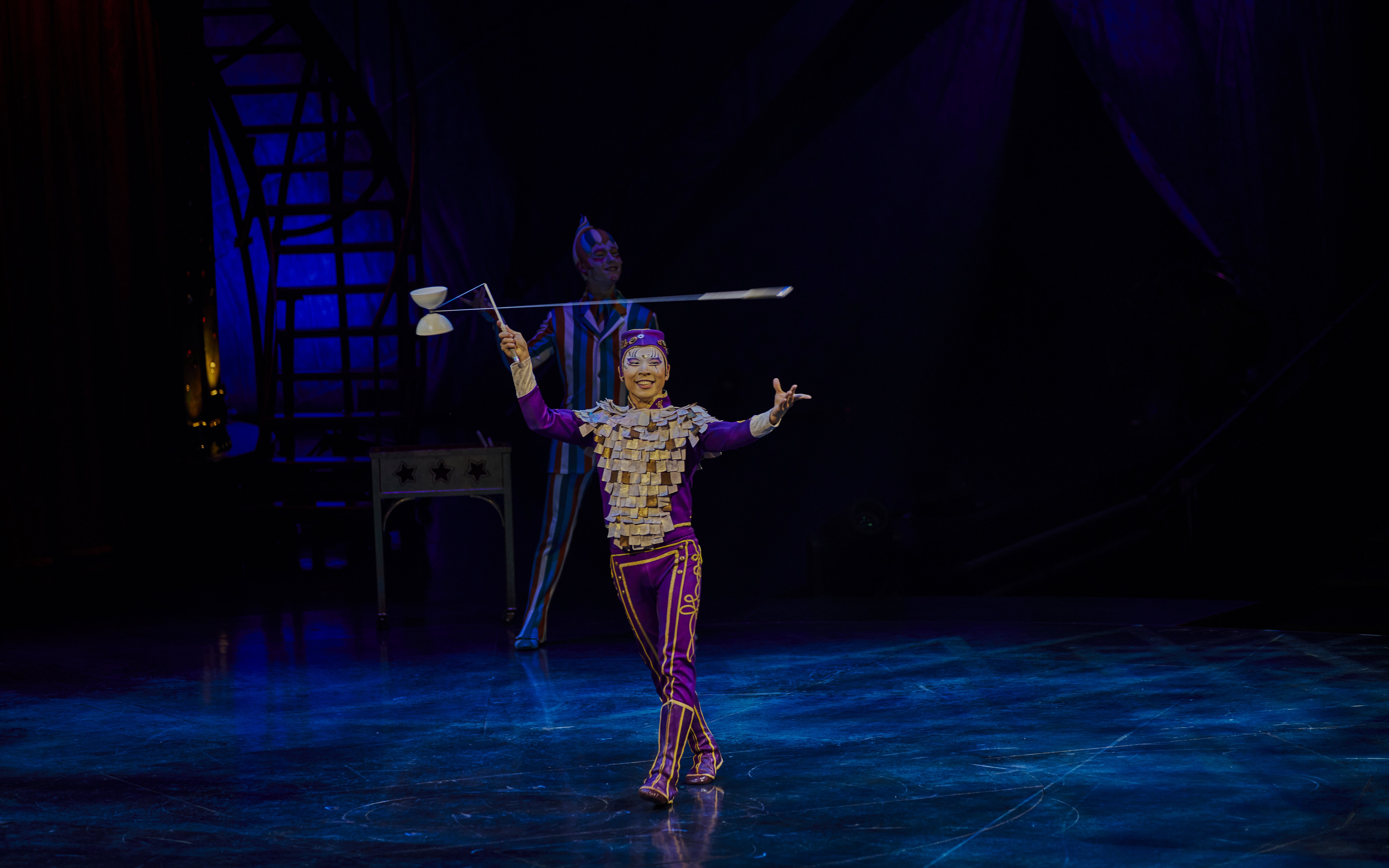 Performer juggling diabolo on stage during Kooza show in Brisbane.