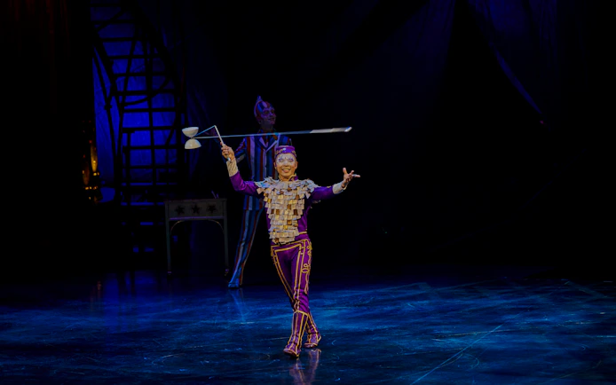 Performer juggling diabolo on stage during Kooza show in Brisbane.