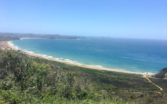 Coastal view of Emerências and José Gonçalves, Rio de Janeiro, with lush greenery and ocean.