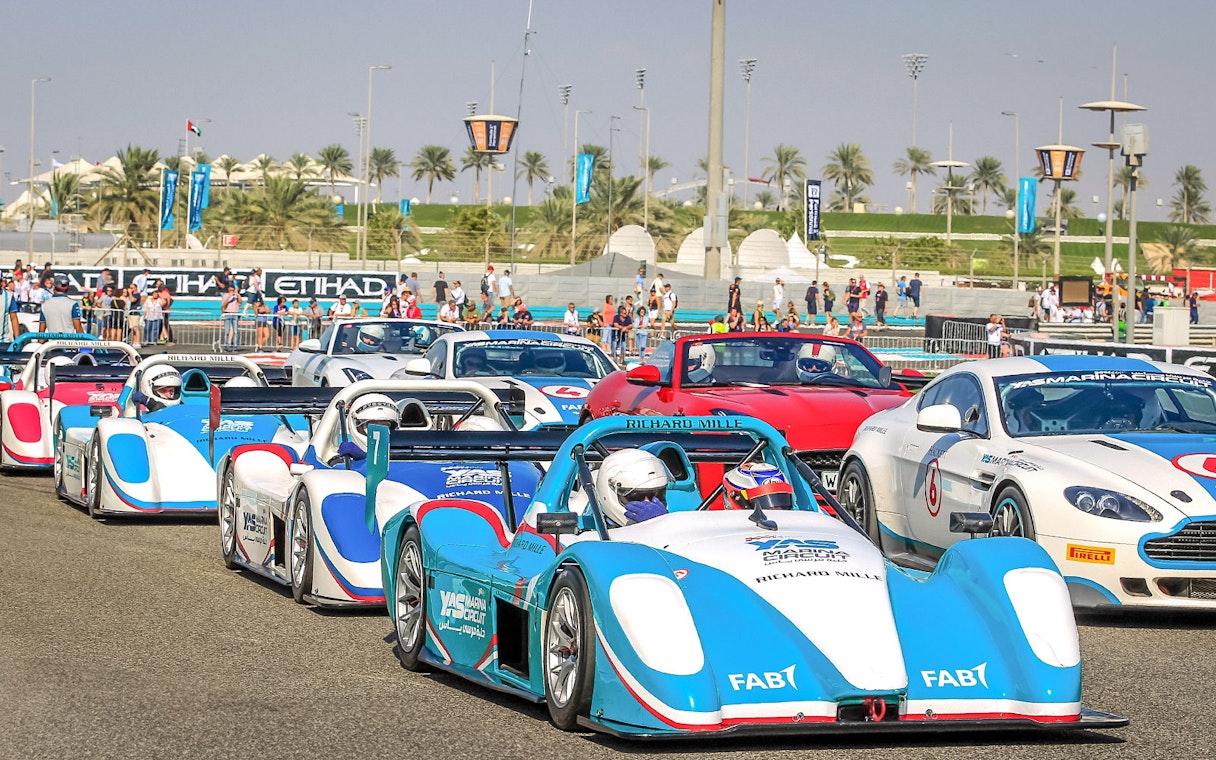 Race cars lined up for the YAS Radical SST Passenger experience at Yas Marina Circuit.