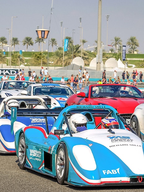 Race cars lined up for the YAS Radical SST Passenger experience at Yas Marina Circuit.